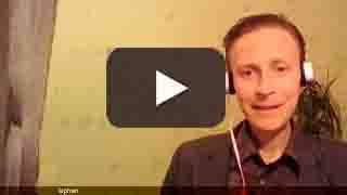 Picture is a link to Stephan's podcast, picture showsn him wearing headphones and speaking with a warm smile.